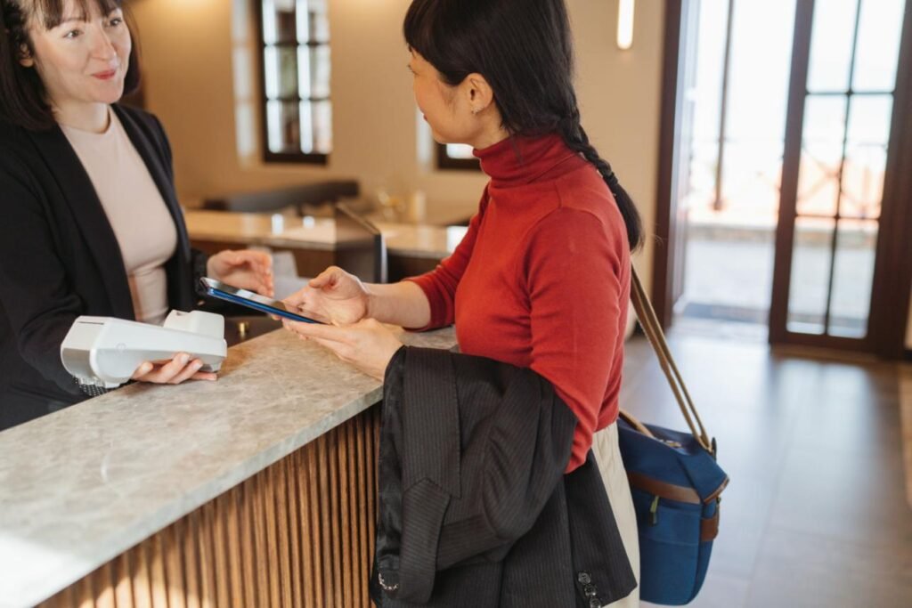 A lady in a hotel reception checking in